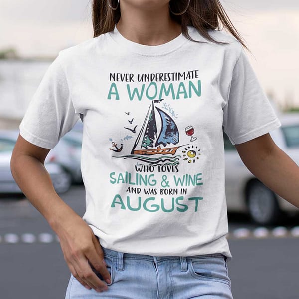 never underestimate a woman who loves sailing and wine shirt august
