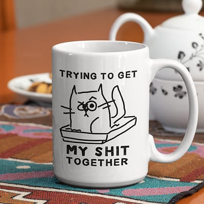 mockup of a customizable rim coffee mug next to a porcelain teapot 33809 e1629626281404